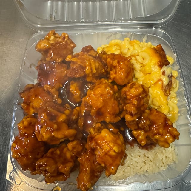 General Tso Chicken with White rice and two sides of your choice.